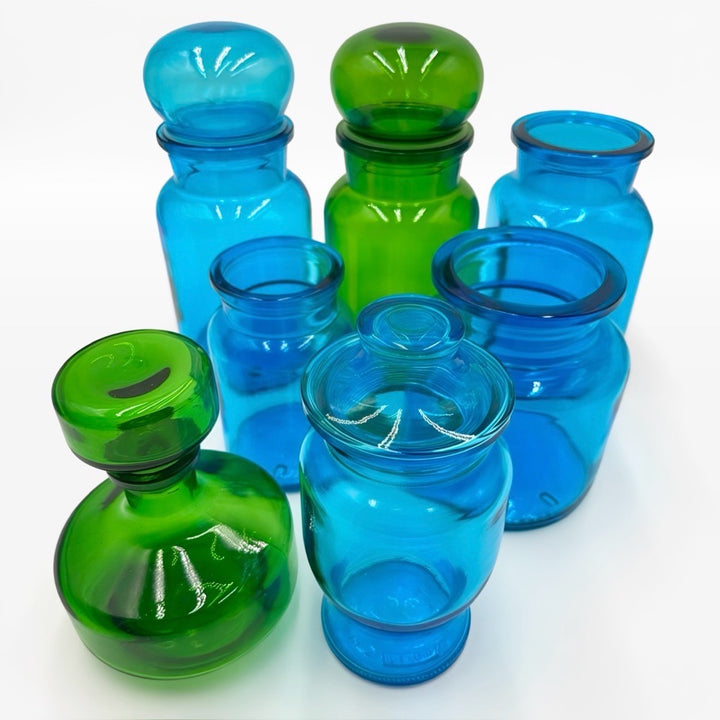 Bocaux publicitaires en verre moulé bleu et vert années 70
