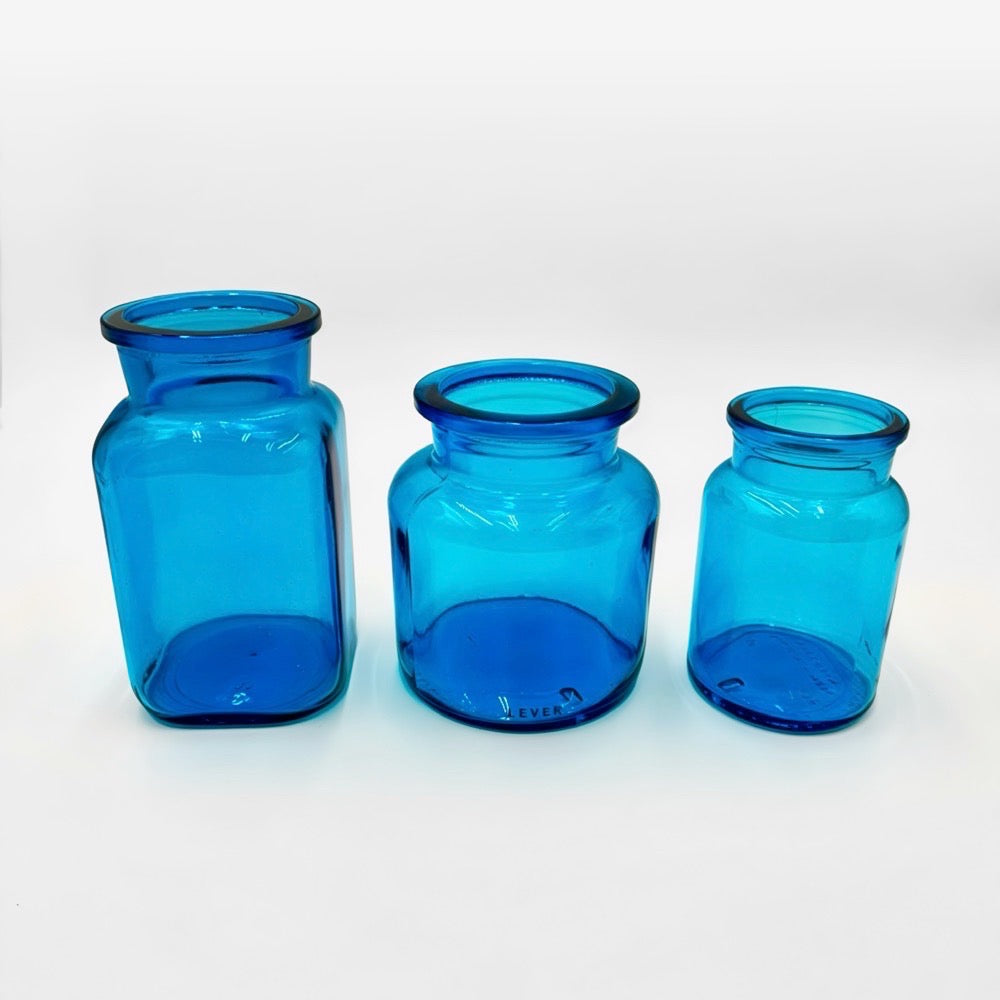 Bocaux publicitaires en verre moulé bleu et vert années 70