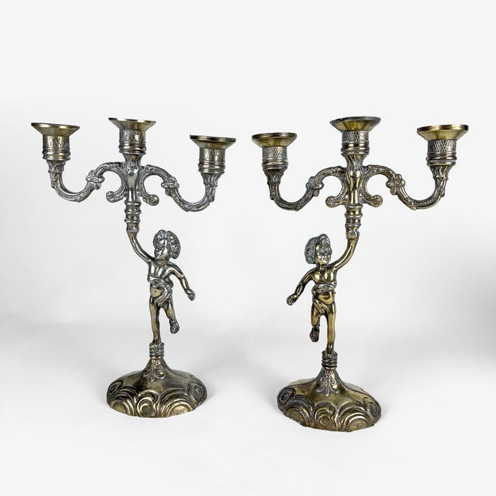 Paire de chandeliers anciens chérubins métal doré