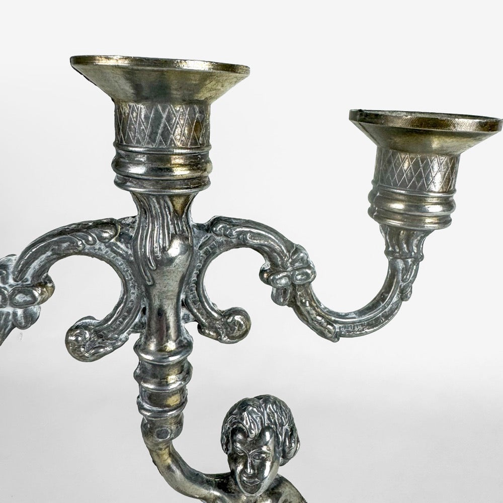 Paire de chandeliers anciens chérubins métal doré