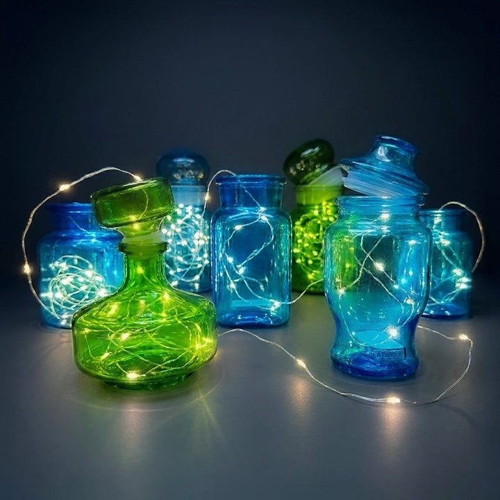 Bocaux publicitaires en verre moulé bleu et vert années 70