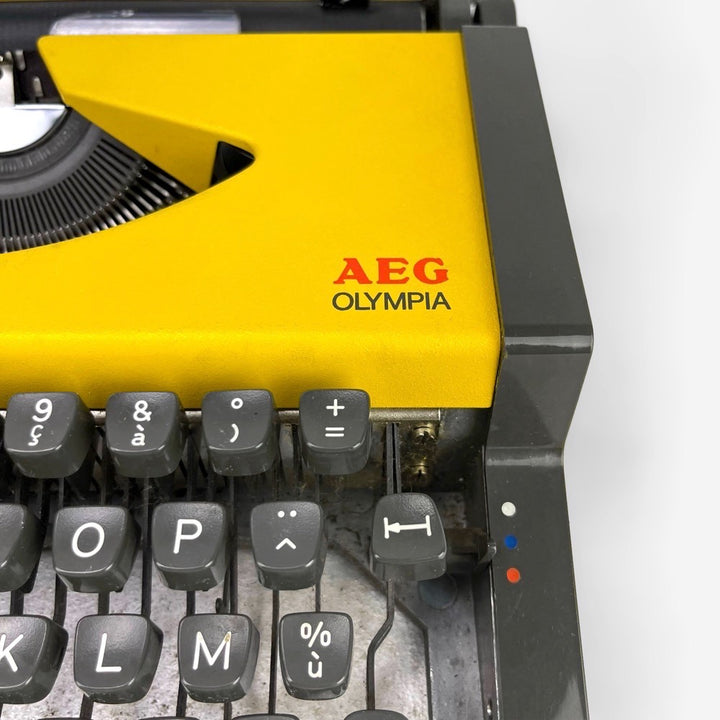 Machine à écrire Dactymétal de Luxe AEG Olympia jaune