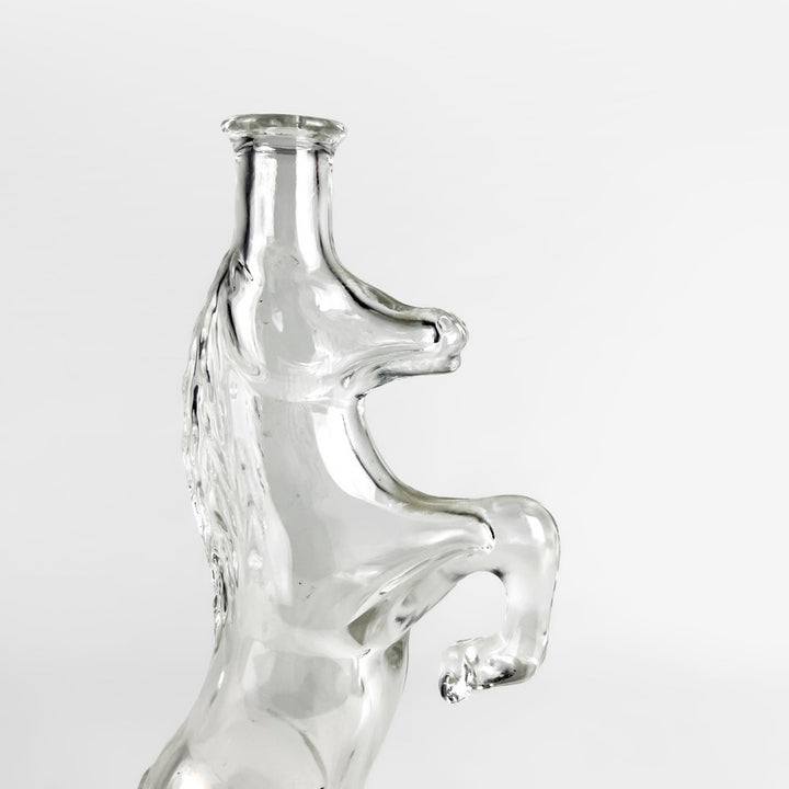 Bouteille zoomorphe cheval cabré en verre moulé