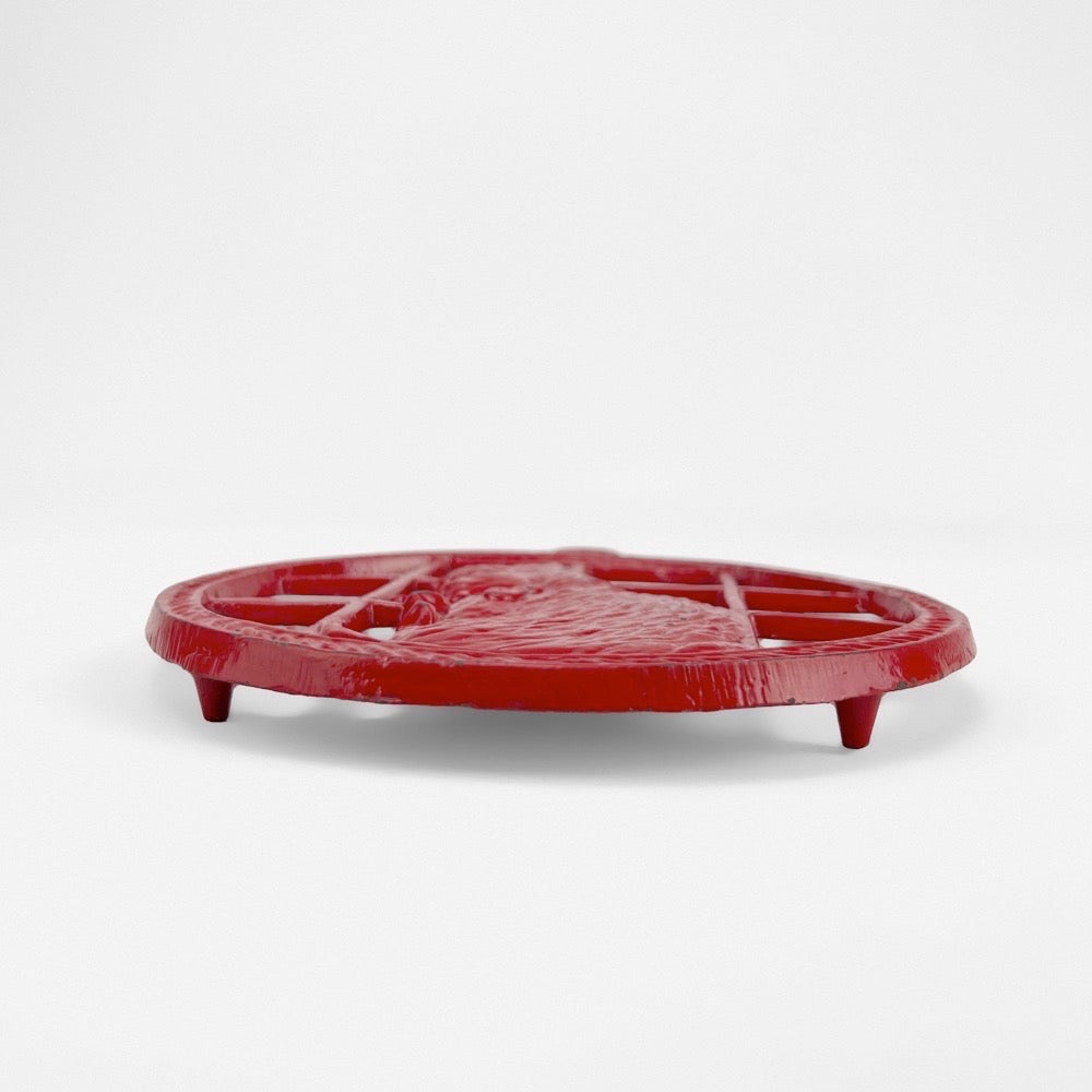 Dessous de plat rouge en fonte décor chat